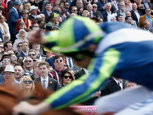 MELBOURNE, AUSTRALIA - NOVEMBER 07:  Racing fans watch race 1 the Emirates 100th A380 Stakes during Melbourne Cup Day at Flemington Racecourse on November 7, 2017 in Melbourne, Australia.  (Photo by Darrian Traynor/Getty Images)