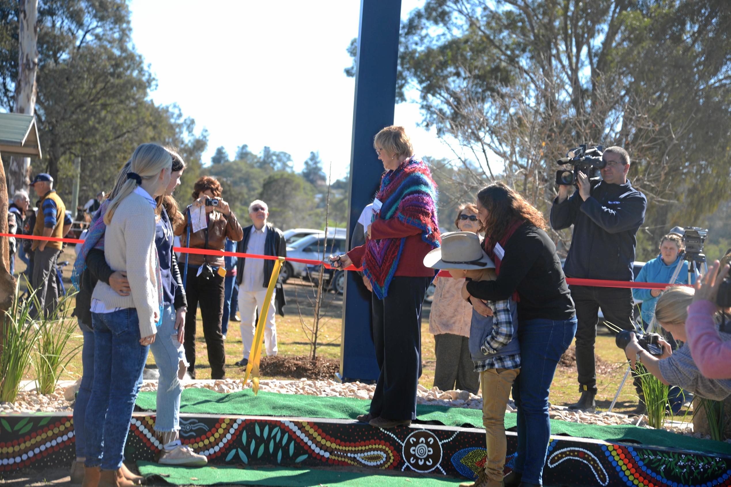 Mavis Simpson officially opens the sculpture. Picture: Gerard Walsh