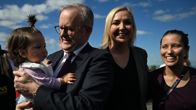 Prime Minister Anthony Albanese, with the candidate for the seat of Ryan, Rebecca Hack (centre), and a supporter’s baby at Mount Coot-Tha lookout in Brisbane. Picture: Dan Peled / NewsWire