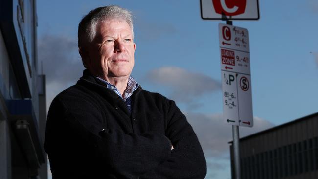 Small Business Council chief Robert Mallett stands next to a parking sign on Bathurst Street. Picture: Zak Simmonds