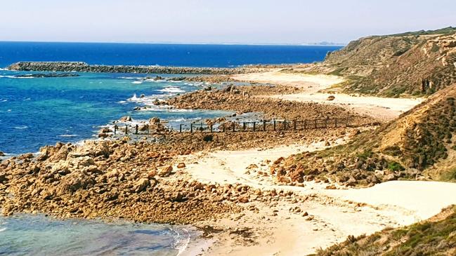 The Port Stanvac foreshore with remnants of the jetty in the background. Picture: Chloe Kowalczuk