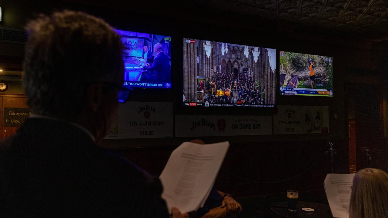 Melbourne, Australia: Patrons sing a hymn during the telecast of the Queen Elizabeth II funeral being telecast at the Young &amp; Jacksons Pub. Picture: Getty Images