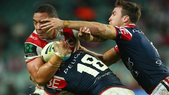 Dragon Tyson Frizell is brought to a halt by Roosters Brendan Elliot and James Maloney at Allianz Stadium. Picture: Mark Kolbe/Getty Images.