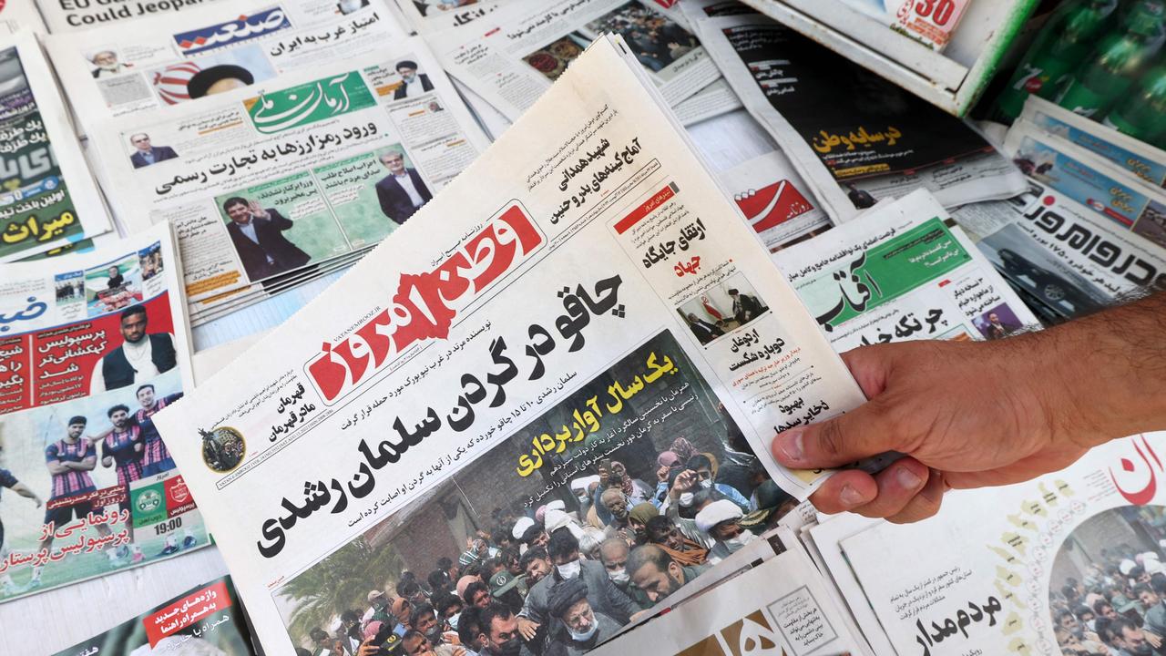 An Iranian newspaper reads, ‘Knife in the neck of Salman Rushdie.’ Picture: Atta Kenare/AFP