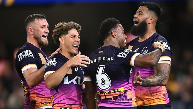 BRISBANE, AUSTRALIA - JULY 27: Ezra Mam of the Broncos celebrates with team mates after scoring a try during the round 22 NRL match between Brisbane Broncos and Sydney Roosters at The Gabba on July 27, 2023 in Brisbane, Australia. (Photo by Albert Perez/Getty Images)