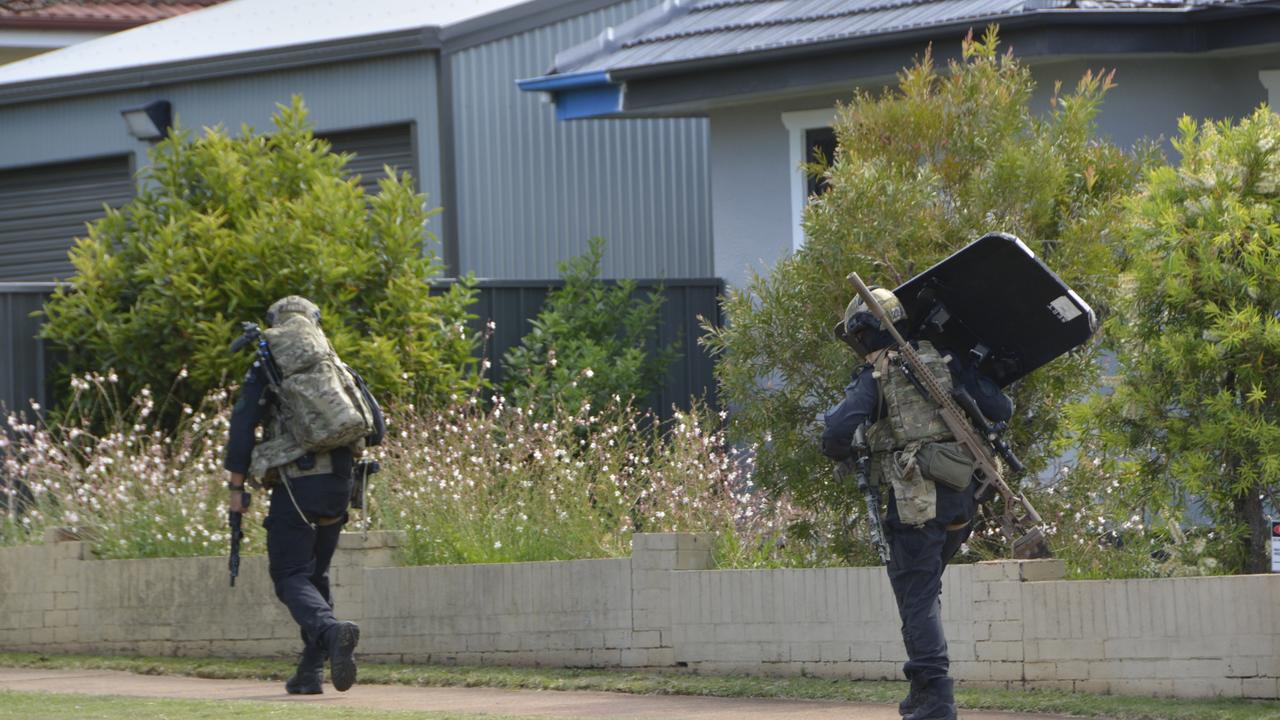 Officers from the Special Emergency Response Team on the scene of a standoff between police and an armed gunman at a Park St address in Newtown on December 21, 2022.