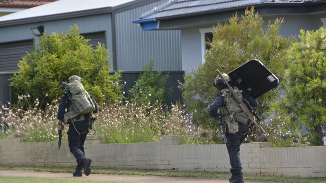 Officers from the Special Emergency Response Team on the scene of a standoff between police and an armed gunman at a Park St address in Newtown on December 21, 2022.