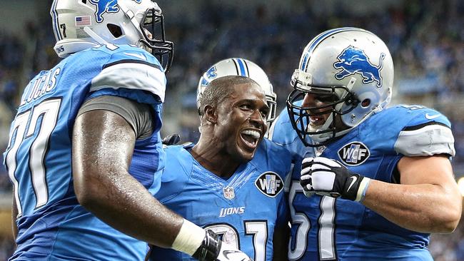 Reggie Bush celebrates a touchdown last NFL season.