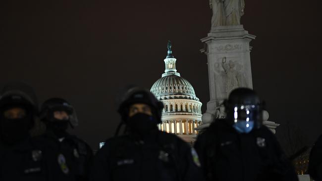 Riot police move in a line outside the US Capitol. Picture: AFP.