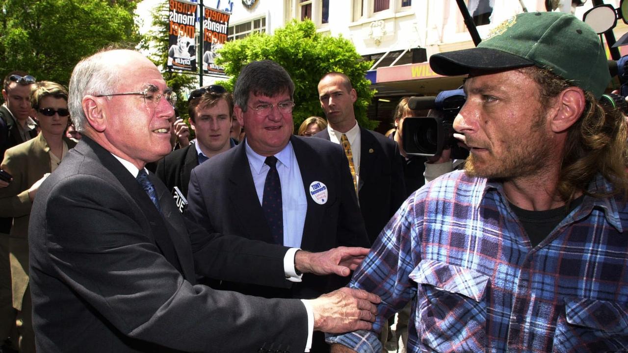 Then-prime minister John Howard with Liberal candidate for seat of Bass Tony Benneworth is confronted by local Mark Bye during unplanned street walk through Launceston Plaza while on campaign trail for the 2001 federal election. Picture: John Feder