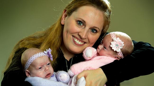 Mrs Lichtenstein with her 12 week old baby girls, Mila in purple and Mika in pink. Picture: Jay Town