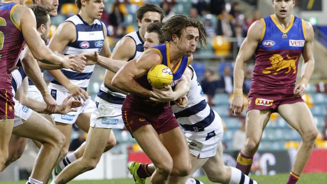 Rhys Mathieson attempts to break a tackle the last time the two teams met at the Gabba. Picture: AAP Image/Glenn Hunt