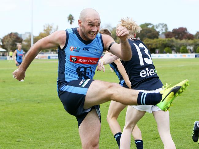 SANFL - South Australian Football Anzac Day Round 5 Sturt v South Adelaide at Unley Oval. Sturt Player Captain Zane Kirkwood caught mid kick. (AAP/Emma Brasier)