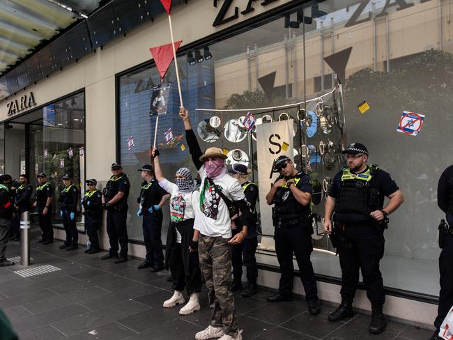 Police line the front of the Zara store in Bourke St during a pro-Palestine protest. Picture: Diego Fedele