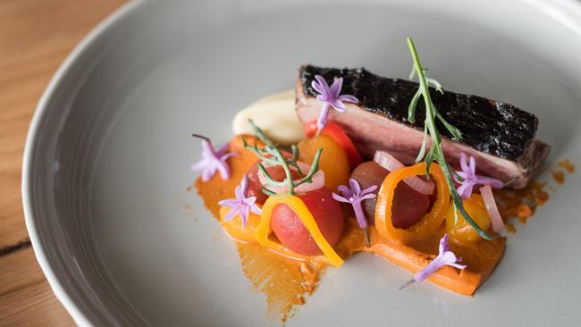 Lamb rump with black and white garlic, romesco and tomatoes at Underbar. Picture: Jo O’Kelly