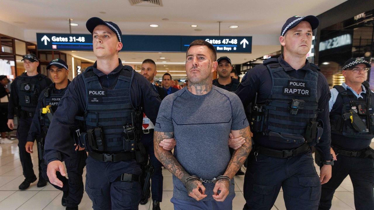 He landed in Sydney on Friday afternoon with a police escort. Picture: NCA NewsWire / David Swift