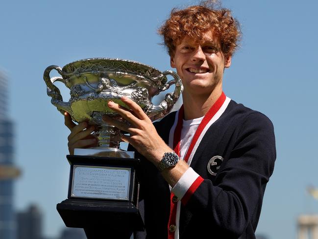 MELBOURNE, AUSTRALIA - JANUARY 29: Jannik Sinner of Italy poses with the Norman Brookes Challenge Cup after winning the 2024 Australian Open Final, at Royal Botanic Gardens on January 29, 2024 in Melbourne, Australia. (Photo by Kelly Defina/Getty Images)