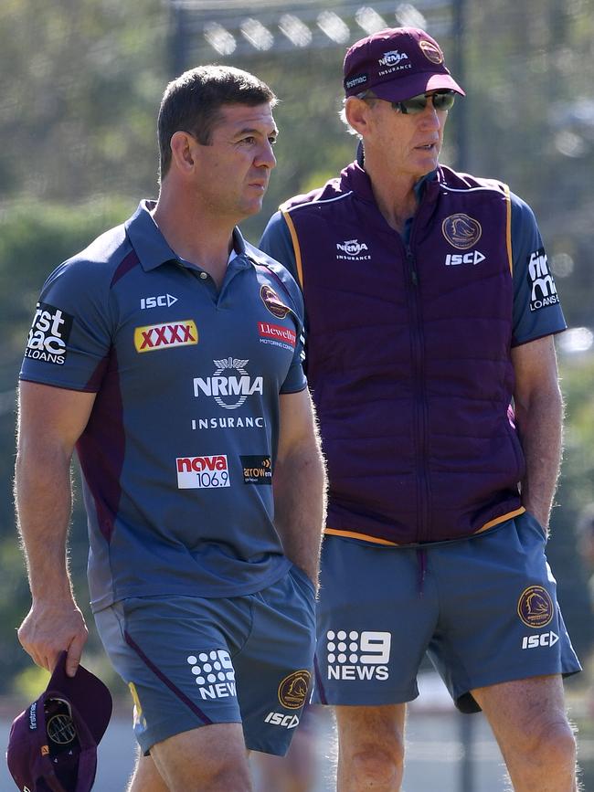 Jason Demetriou (left) with Wayne Bennett during a training session last season. Picture: AAP