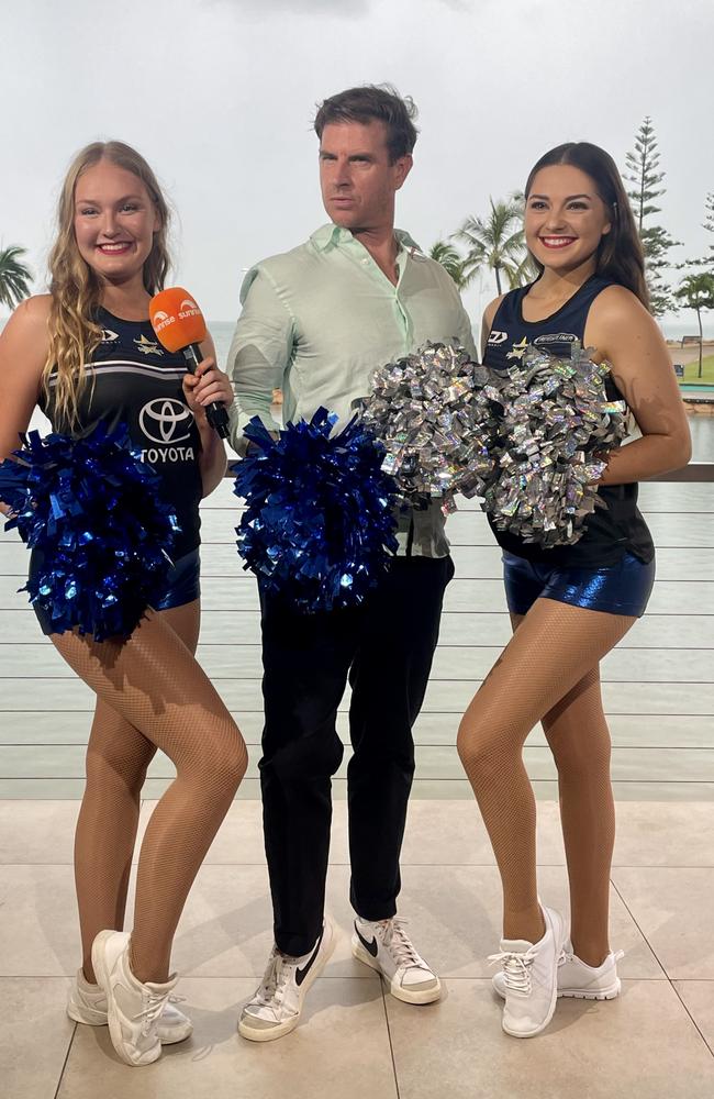 Sunrise host Sam Mac with Cowboys cheerleaders Analise and Emily.