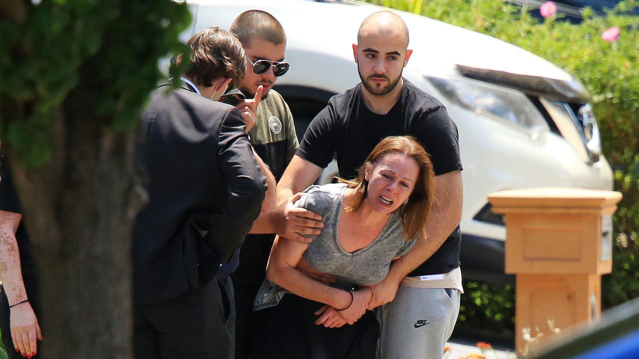 A woman believed to be the deceased's mother is distraught as the coroners van leaves after an apparent homicide in Umbria Rd, Mernda. Picture: Mark Stewart