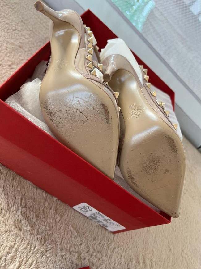 Cynthia Lu showed the scuff marks on the Valentino high heels to prove they were in fairly good condition. Picture: Supplied