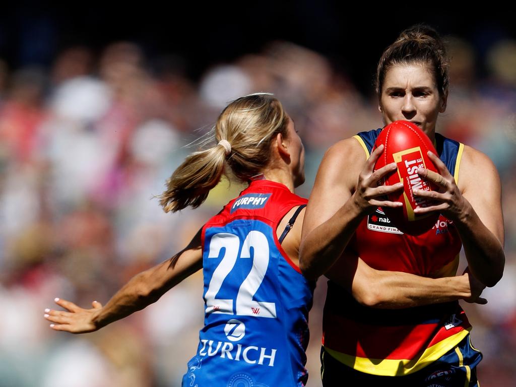 Jasmyn Hewett is tackled by Eliza McNamara during the 2022 AFLW grand final. Picture: Dylan Burns/AFL Photos via Getty Images.