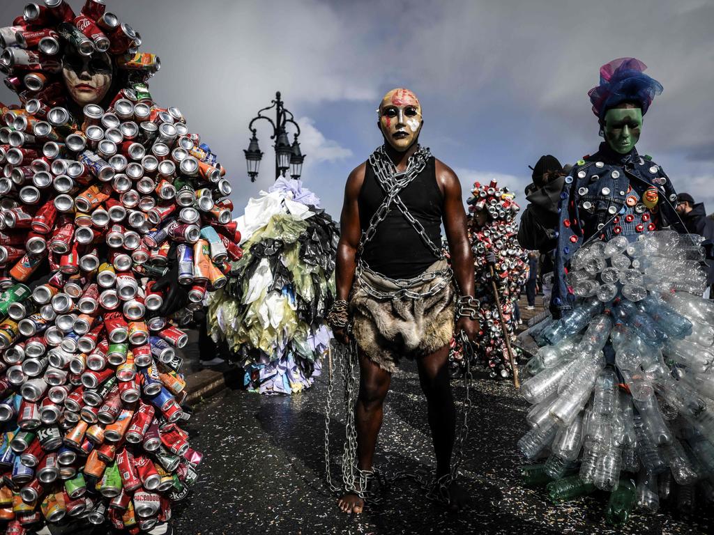 People wearing costumes parade during the Carnaval Des Deux Rives in Bordeaux, France. Pictured: Thibaud Moritz/AFP