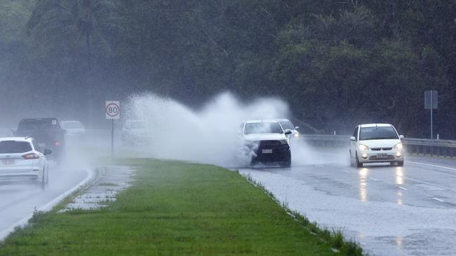 The wet weather that Cairns has experienced this week is forecast to ease over the weekend and into next week, with showers persisting across the Far North. Traffic on the Captain Cook Highway at Aeroglen drive through puddles of standing water after a rain downpour on Friday afternoon. Picture: Brendan Radke