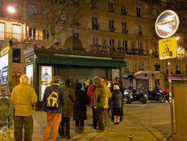 Customers wait in line at Pigalle newsstand, where the new edition of Charlie Hebdo magazine is being sold in Paris, France. Picture: Aurelien Meunier/Getty Images