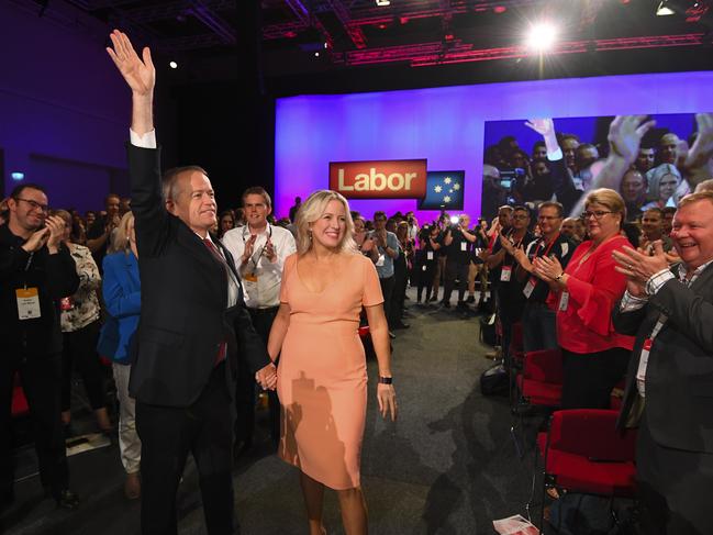 Mr Shorten with wife Chloe is applauded by delegates as he arrived at the national conference on Sunday. Picture: AAP