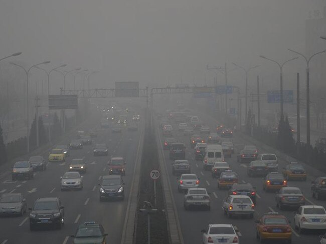 Cars travel on a road in heavy smog in Beijing, China, 29 January 2013. Endless lines of slow-moving cars emerge like apparitions and then disappear again into the gloom of the thick smog that has shrouded Beijing this week and reduced its skyline to blurry gray shapes. With more than 13 million cars sold in China last year, motor vehicles have emerged as the chief culprit for the throat-choking air pollution in big cities especially Beijing, which has suffered even more than usual these past few days. As the Chinese middle-class expanded dramatically over the last 20 years, cars became the new symbol of prosperity. With the economy continuing to grow, the love affair with cars will only bloom more, and is already posing a challenge for dealing with the hazardous air pollution in urban China with widespread impact on health, productivity and quality of life.