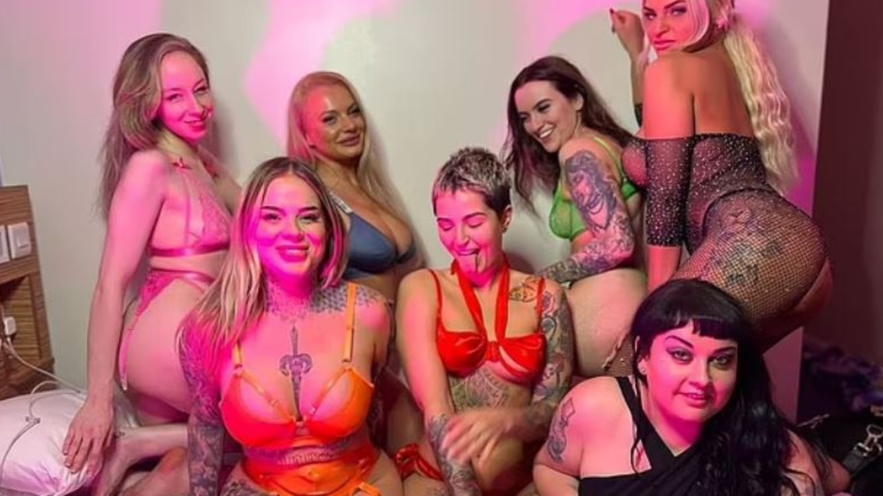 Seven of the women in the group were pictured sitting on one bed. Picture: Instagram/laceyamourx