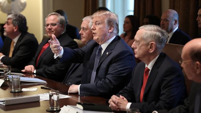 President Donald Trump speaks while meeting with members of his cabinet in Washington.