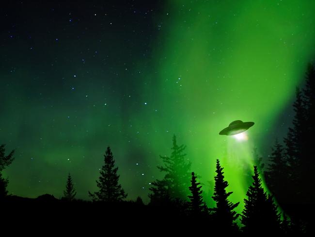 UFO landing at night in the forest with trees and stars.