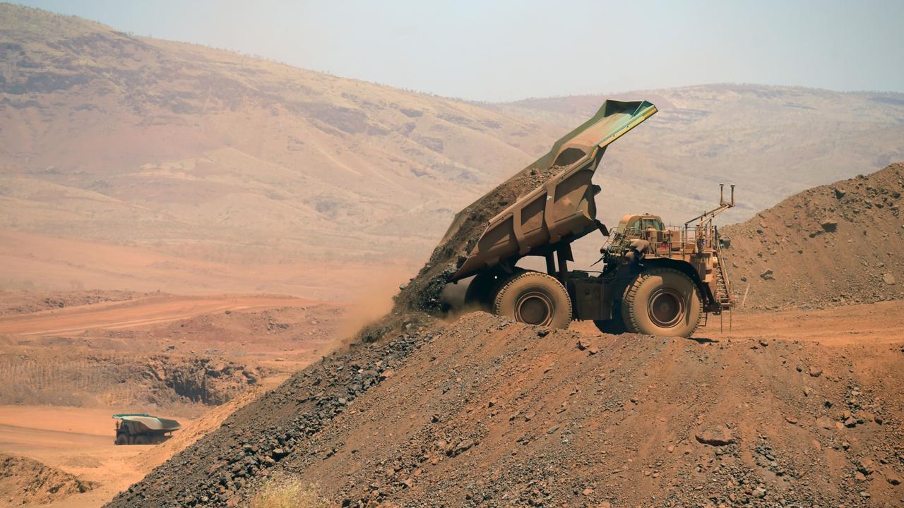 An autonomous haul truck dumps a load of rock in the mine pit at Rio Tinto's Gudai-Darri iron ore mine in the Pilbara region of Western Australia. Picture: Carla Gottgens/Bloomberg