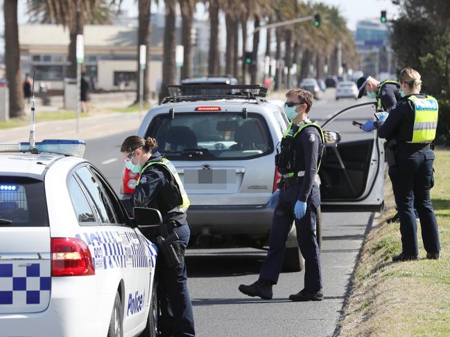 MELBOURNE, AUSTRALIA- NewsWire Photos SEPTEMBER 1, 2020: Police conduct roadside checks in Middle Park on he first day of spring as people are seen exercising along the foreshore during a stage four COVID-19 lockdown in Melbourne. Picture: NCA NewsWire/ David Crosling