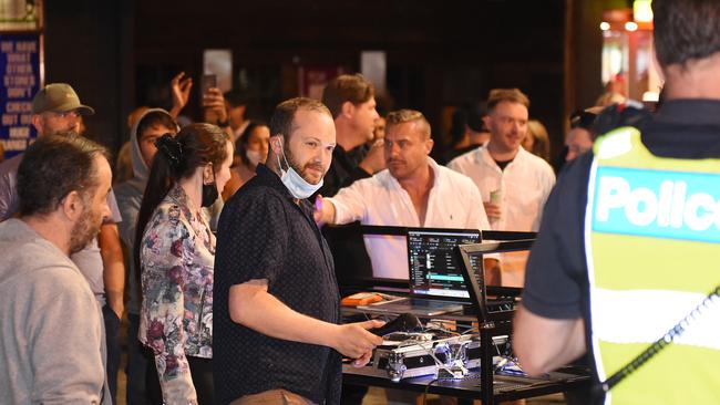 The Acland St DJ with his mask pulled down to his chin. Picture: Josie Hayden