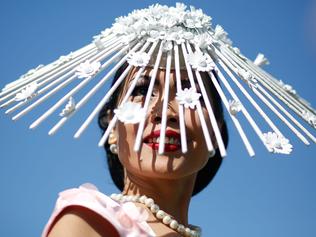 MELBOURNE, AUSTRALIA - NOVEMBER 03: Racegoers enjoy the atmosphere on Melbourne Cup Day at Flemington Racecourse on November 3, 2015 in Melbourne, Australia. (Photo by Zak Kaczmarek/Getty Images for the VRC)