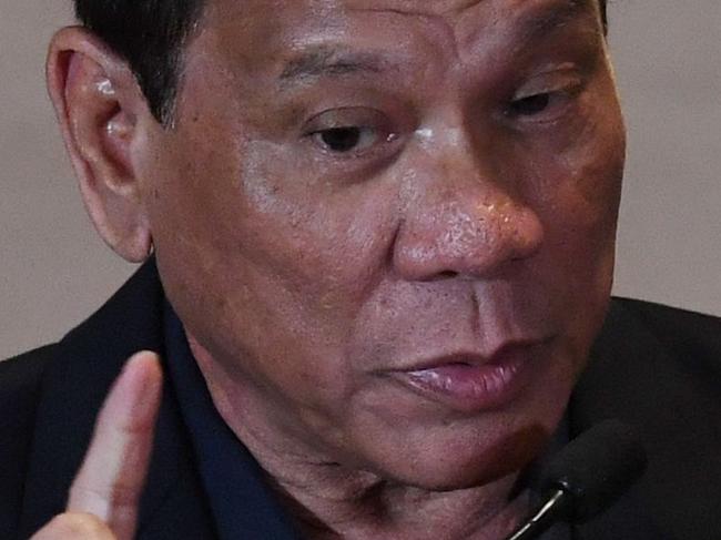 Philippine President Rodrigo Duterte speaks during a press conference in Beijing on October 19, 2016. Visiting Philippine President Rodrigo Duterte had praise for China on October 19, setting aside a maritime dispute as the combative leader reconfigures his country's diplomatic alliances. / AFP PHOTO / POOL / IWASAKI MINORU
