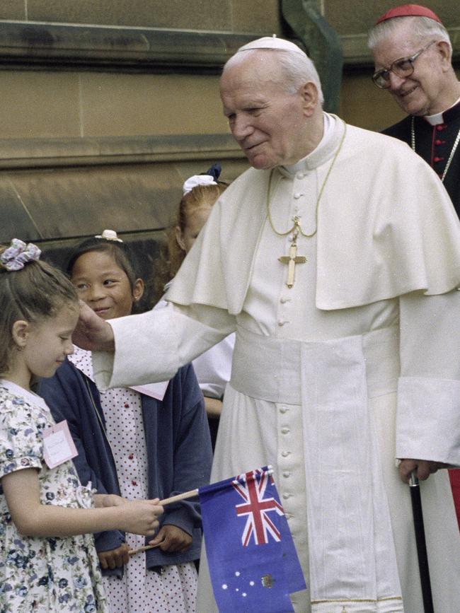 His Holiness Pope John Paul II blesses a young girl during his visit to Sydney for the beatification of Mary MacKillop, 19 January 1995.