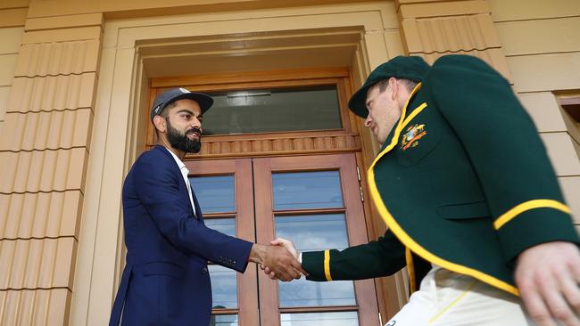 ADELAIDE, AUSTRALIA - DECEMBER 05: Virat Kohli of India and Tim Paine of Australia shake hands ahead of the Test series between Australia and India at Adelaide Oval on December 05, 2018 in Adelaide, Australia. (Photo by Ryan Pierse/Getty Images)