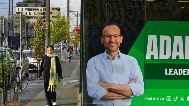 Greens leader Adam Bandt, seen on a street poster, has lost his Melbourne seat to Labor. Picture: Luis Enrique Ascui
