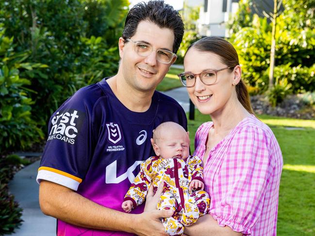 Damian and Sally Torrie with baby William, the Broncos’ youngest member. Picture: Richard Walker