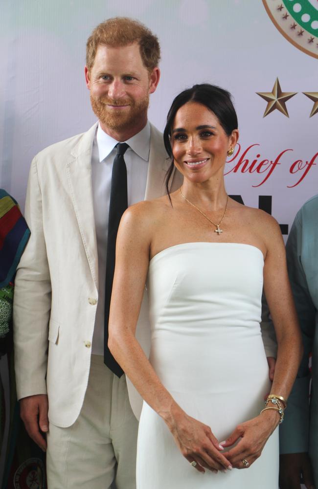 Prince Harry, Duke of Sussex, and Britain's Meghan, Duchess of Sussex, pose for a photo as they attend the program held in the Armed Forces Complex in Abuja, Nigeria on May 11. Picture: Emmanuel Osodi/Anadolu via Getty Images