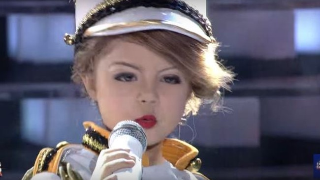 Xia Vigor impersonates Taylor Swift on <i>Your Face Sounds Familiar Kids.</i>