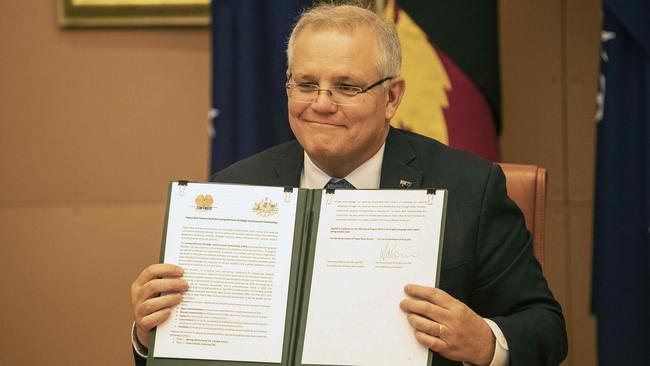 Scott Morrison and PNG Prime Minister James Marape signed an strategic economic agreement of intent after a virtual summit last august. Picture: NCA NewsWire/Gary Ramage