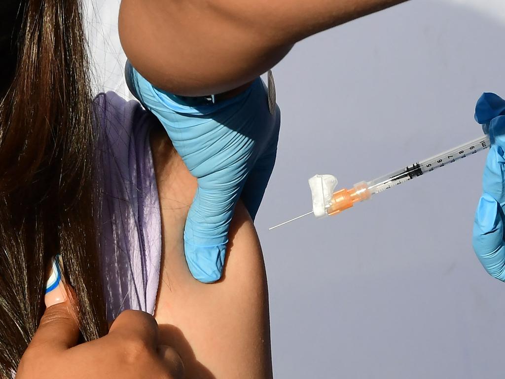 A child receives a dose of Pfizer's Covid-19 vaccine in Los Angeles. Picture: Frederic J. Brown/AFP