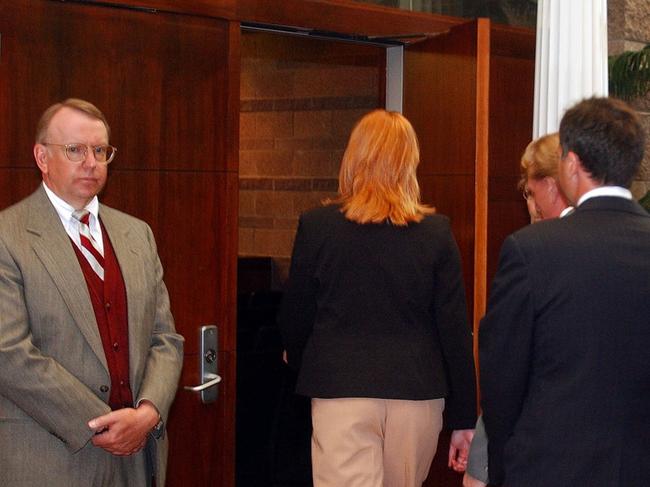 Clune, right, walks into court in 2004 during the Kobe Bryant case