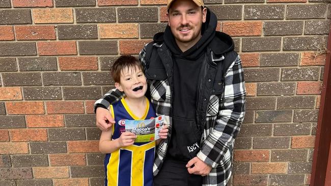 Chase with dad Daniel Morgan as his entire family rallies for his fight against cancer. Picture: Supplied