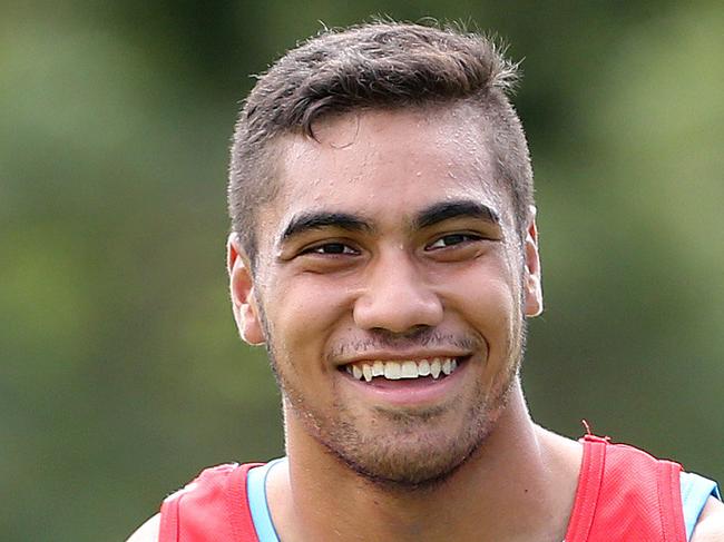 John Olive in action during Gold Coast Titans training at Burleigh Heads. Pics Adam Head